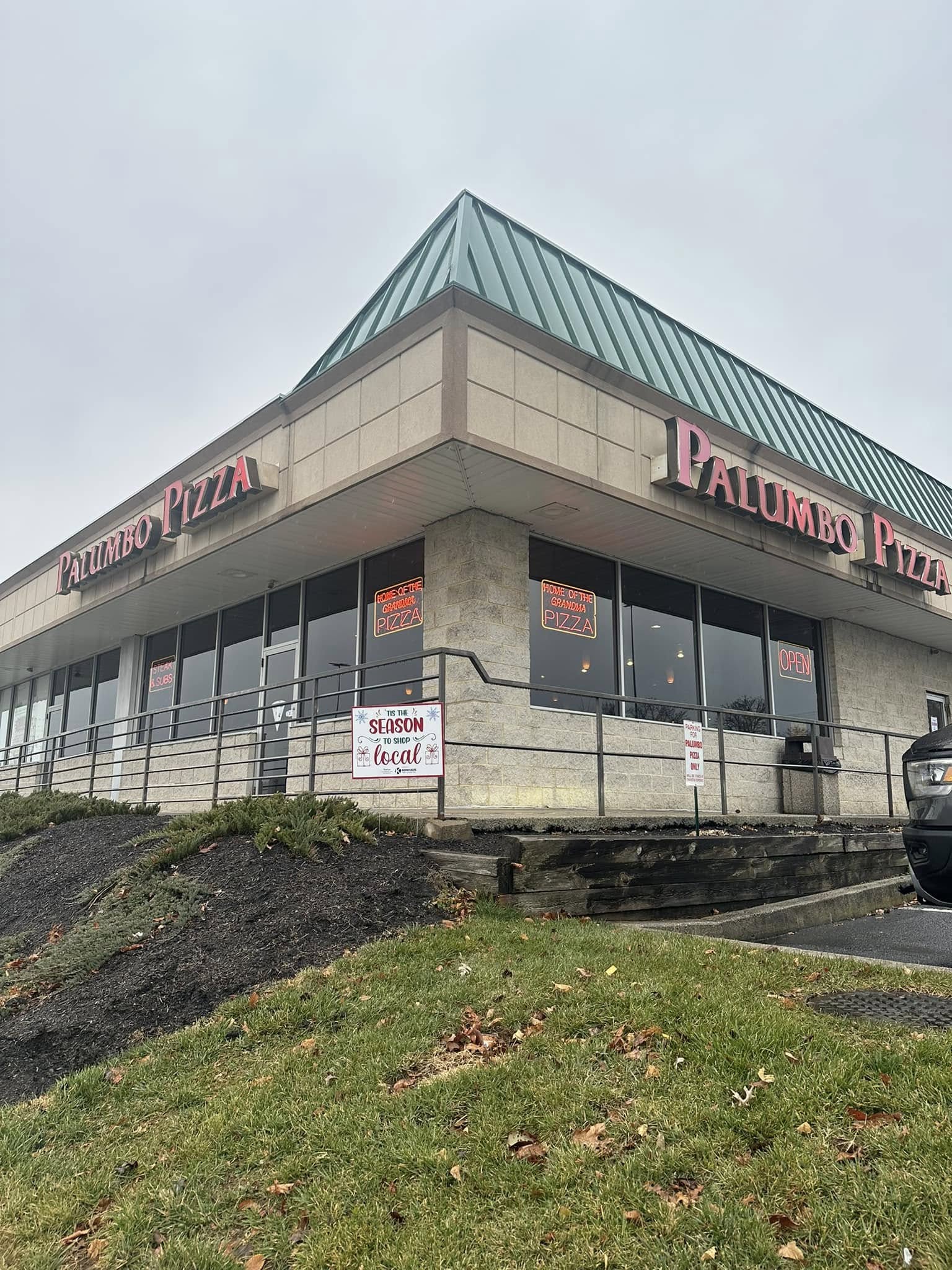 Front entrance and exterior signage for Palumbo Pizza at 4930 Carlisle Pike in Hampden Township PA